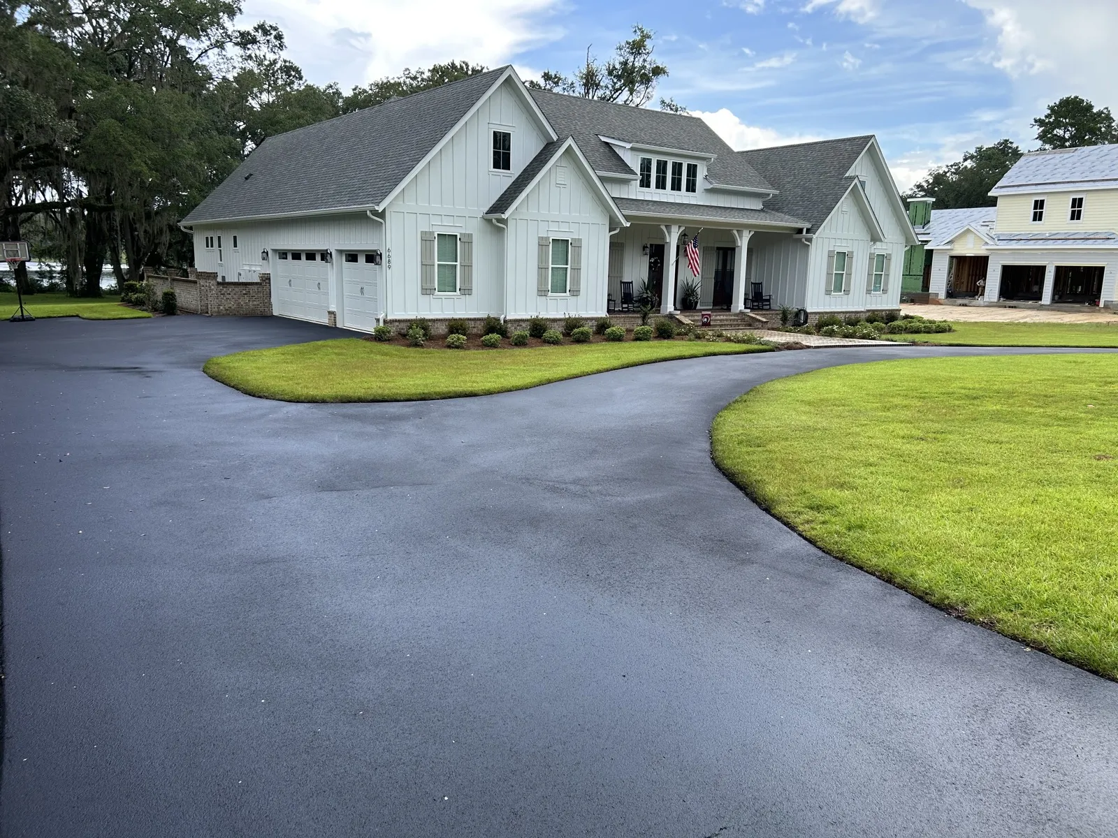 Freshly sealed residential driveway by American Curb Appeal